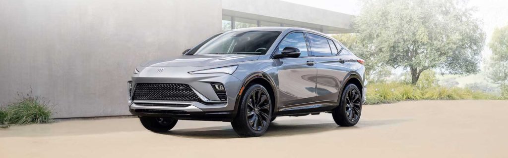 2025 Buick Envista parked in front of a mansion