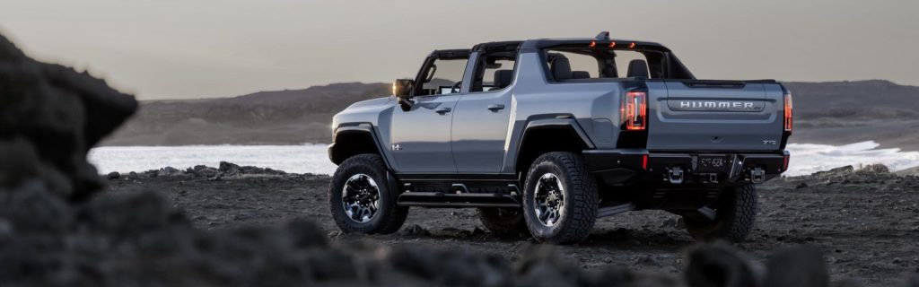 2025 GMC Hummer EV Pickup parked on the beach